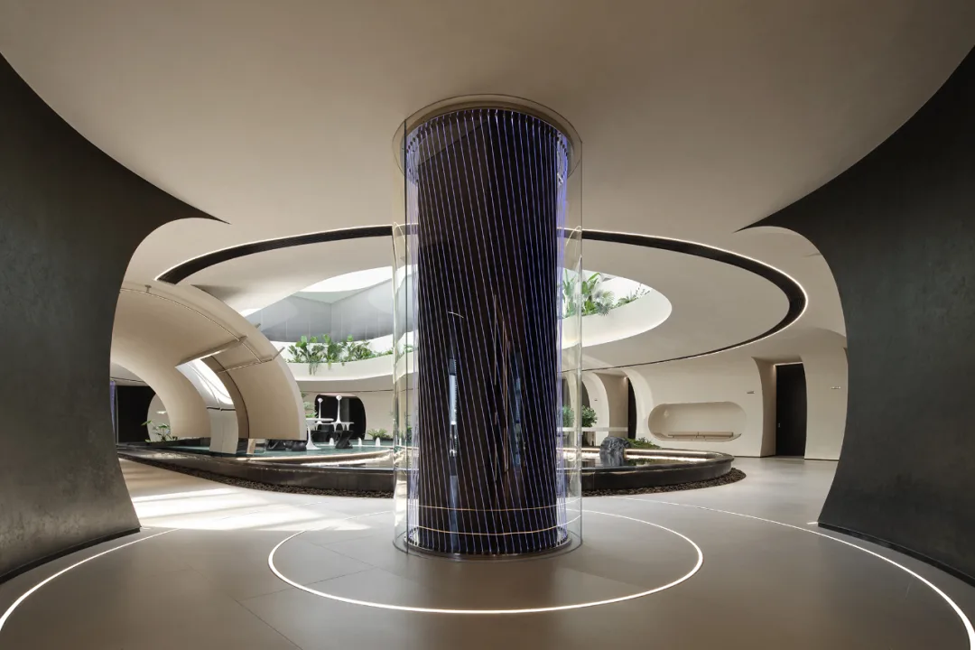 Material Gene Institute interior with curved architectural surfaces, dark texture and soft circular light