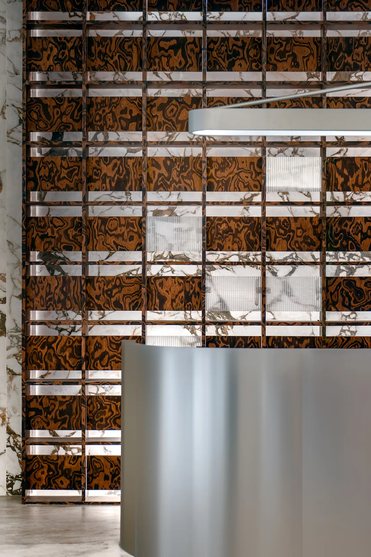 Commercial showroom interior shaped by surface texture and soft lighting