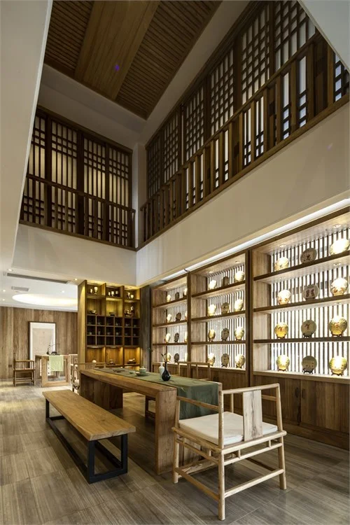 Tea display room rising beneath a two-storey timber screen