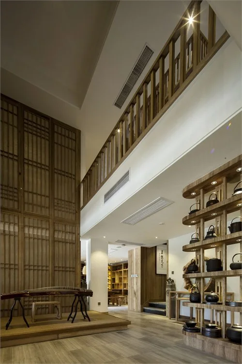 Tall timber lattice and teapot display closing the exhibition route
