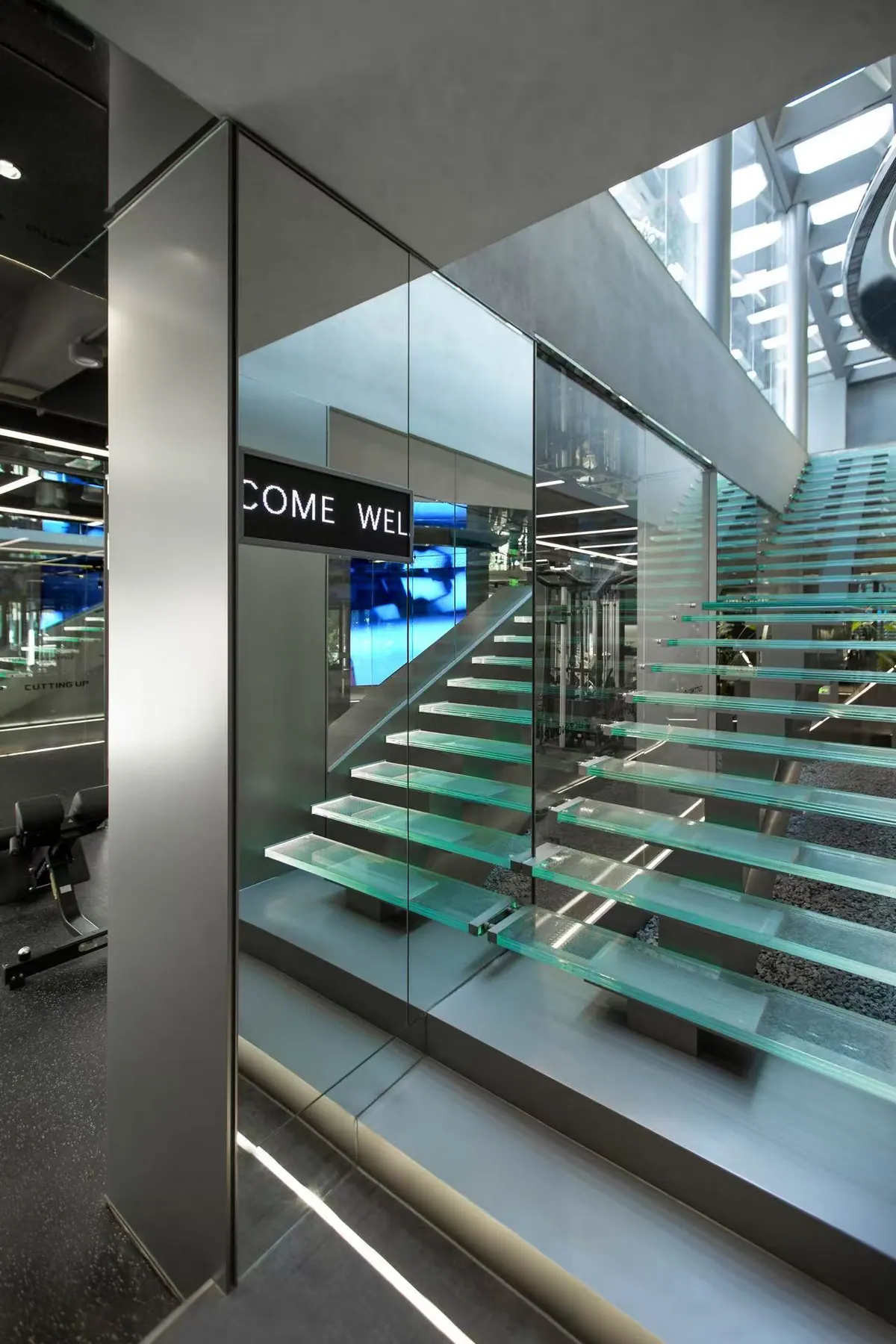 Interior stair space showing texture, light and warm material atmosphere